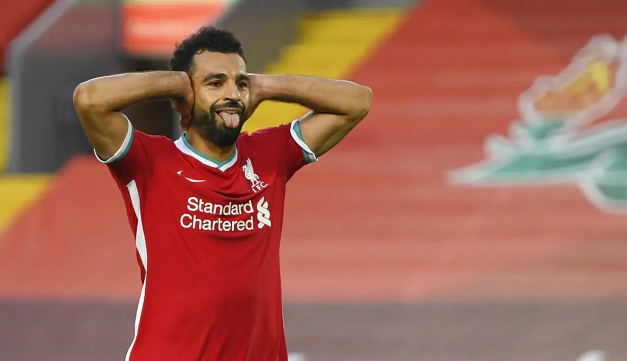 Penyerang Liverpool, Mohamed Salah, melakukan selebrasi usai mencetak gol ke gawang Leeds United pada laga Premier League di Stadion Anfield, Minggu (13/9/2020). Liverpool menang dengan skor 4-3. (Shaun Botterill, Pool via AP)