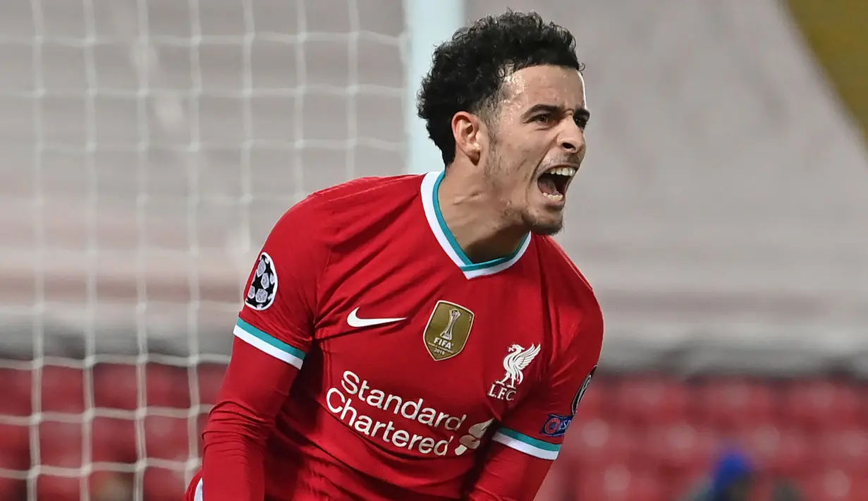 Gelandang Liverpool, Curtis Jones, melakukan selebrasi usai mencetak gol ke gawang Ajax Amsterdam dalam laga lanjutan Liga Champions 2020/21 Grup D di Anfield Stadium, Liverpool, Selasa (1/12/2020) waktu setempat. Liverpool menang 1-0 atas Ajax. (AFP/Paul Ellis/Pool)