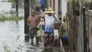 Kuba mengalami curah hujan setinggi 4 inci pada hari Minggu, demikian laporan stasiun meteorologi setempat, menurut Associated Press. (AP Photo/Ramon Espinosa)
