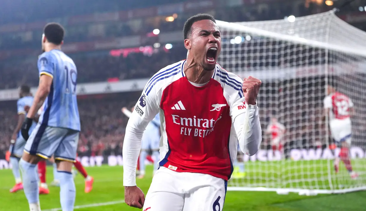 Arsenal sukses mengalahkan Tottenham dengan comeback apik 2-1 dalam laga pekan 21 Premier League 2024/2025 yang digelar di Emirates Stadium, Kamis (16/1/2025) dini hari WIB. (Bradley Collyer/PA via AP)