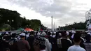 Ribuan peserta menghadiri Aksi Bela Palestina di kawasan silang Monas, Jakarta, Minggu (17/12). Aksi ini dilakukan untuk menentang keras pengakuan sepihak Presiden AS Donald Trump atas Yerusalem sebagai ibu kota Israel. (Liputan6.com)