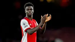 Bukayo Saka - Gelandang serba bisa ini adalah sosok kunci di tim Inggris asuhan Gareth Southgate yang menjadi runner-up di Euro 2020 lalu. Namun sayang, talenta muda ini hanya mendapat bayaran 30 ribu Pounds perpekan dari Arsenal. (AFP/Glyn Kirk)