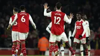 Para pemain Arsenal melakukan selebrasi usai pertandingan sepak bola Liga Inggris antara Arsenal dan Manchester United di stadion Emirates di London, Minggu, 22 Januari 2023. (AP Photo/Ian Walton)