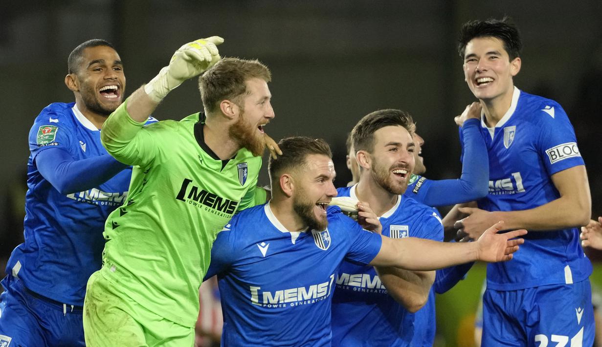 Elkan Baggot dan Gillingham FC yang merupakan klub kasta keempat dalam sistem liga sepak bola Inggris membuat kejutan dengan mengalahkan klub divisi utama Liga Inggris, Brentford. (AP Photo/Kirsty Wigglesworth)