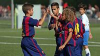 Bakat bocah berambut kribo itu pertama kali terendus oleh akademi Villarreal hingga akhirnya bergabung dengan La Masia. (Topdrawersoccer.com)
