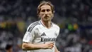 Hal tersebut terungkap pada 22 Mei 2025, Luka Modric mengatakan pada bahwa ia akan meninggalkan klub raksasa Spanyol itu. Tampak dalam foto, gelandang Real Madrid asal Kroasia, Luka Modric bereaksi selama pertandingan sepak bola final Piala Interkontinental FIFA 2024 melawan Pachuca dari Meksiko di Stadion Lusail, Doha, Qatar pada 18 Desember 2024. (KARIM JAAFAR/AFP)