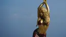 <p>Pemerintah Kota Barranquilla, kampung halaman penyanyi asal Kolombia, Shakira membangun patung perunggu setinggi 6,5 meter (21,3 kaki) untuk menghormati sang diva. (STR / AFP)</p>
