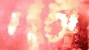 Suporter PSS Sleman menyalakan flare saat melawan Semen Padang pada laga Liga 2 di Stadion Pakansari, Jawa Barat, Selasa (4/12). PSS menang 2-0 atas Semen Padang. (Bola.com/M. Iqbal Ichsan)