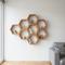 Rak Kayu Hexagonal adalah salah satu desain rak dinding untuk rumah mungil  (Gemini AI)