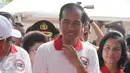 Presiden Joko Widodo didampingi Ibu Negara Iriana Jokowi saat menghadiri acara peringatan Hari Anti Narkotika Internasional (HANI) di kawasan Taman Sari, Jakarta, Minggu (26/6). (Liputan6.com/Herman Zakharia)