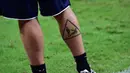 Tato unik De Rossi yang mengambarkan tackling keras, Brasil (13/06/2014) (AFP Photo/Giuseppe Cacace)