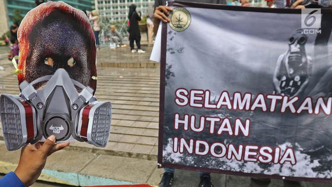 Masyarakat yang tergabung dalam organisasi Lingkar Ganja Nusantara (LGN) Jakarta melakukan aksi yang bertajuk Selamatkan Hutan Indonesia pada Car Free Day di Kawasan Bundaran HI, Jakarta, Minggu (29/9/2019).  (Liputan6.com/Herman Zakharia)