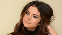 Artis Selena Gomez berpose saat Sundance Film Festival di Getty Images Portrait Studio, Utah, 20 Januari 2014. Selena mengatakan dirinya menjalani kemoterapi setelah didiagnosis menderita penyakit lupus. (Larry Busacca / Getty Images / AFP)