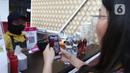 Pembeli melakukan transaksi belanja dengan QRIS di Jakarta, Jumat (28/7/2023). (Liputan6.com/Angga Yuniar)
