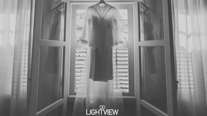 Foto gaun pernikahan calon pengantin wanita yang ditinggal kekasih sebelum hari pernikahan. (dok. Facebook sg.Lightview)