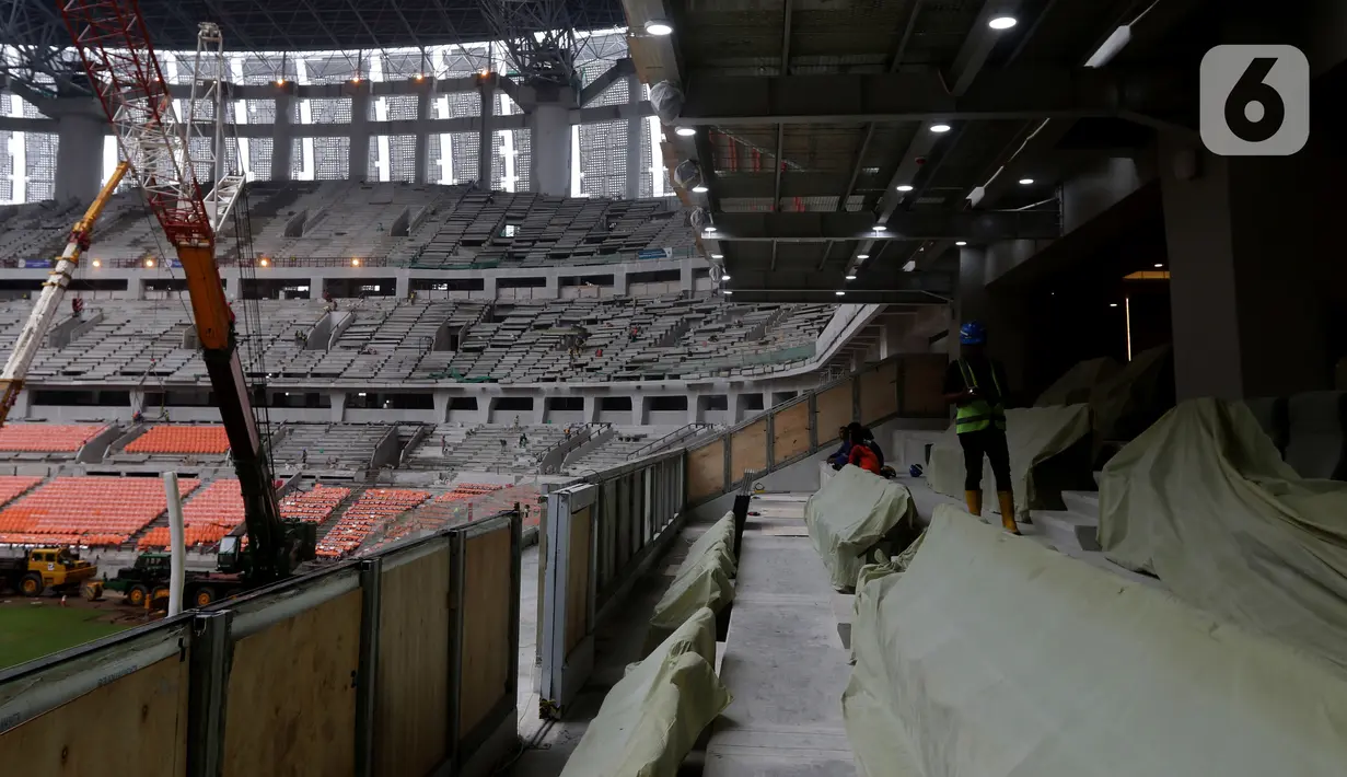 Aktivitas pengerjaan pembangunan Jakarta International Stadium (JIS), Selasa (21/12/2021). Hingga minggu ke-120, progres pembangunan Jakarta International Stadium telah mencapai 90,88 persen dan ditarget bakal resmi digunakan pada triwulan pertama 2022. (Liputan6.com/Helmi Fithriansyah)