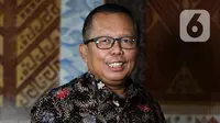 Calon hakim Mahkamah Konstitusi (MK) Arsul Sani berpose usai wawancara khusus dengan Liputan6.com di Jakarta, Kamis (11/1/2024). (Liputan6.com/Herman Zakharia)