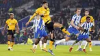 Gelandang Wolverhampton Wanderers, Romain Saiss mencetak gol ke gawang Brighton & Hove Albion pada laga pekan ke-17 Liga Inggris di Stadion Amex, Kamis (16/12/2021) dini hari WIB. Wolves mengalahkan Brighton & Hove Albion dengan skor 1-0. (Gareth Fuller/PA via AP)