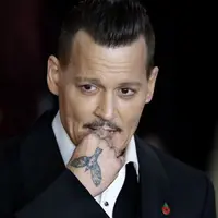 Baru-baru ini kehidupan Johnny Depp bisa dibilang mengalami banyak perubahan. Terlebih saat dirinya berpisah dengan sang istri, Amber Heard. Hal ini berpengaruh terhadap kondisi perekonomiannya. (AFP/Tolga Akmen)