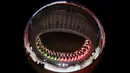 Gambar lensa fisheye menunjukkan kembang api yang menerangi langit pada awal upacara pembukaan Paralimpiade Tokyo 2020 di Olympic Stadium, Tokyo, Selasa (24/8/2021). Setelah ditunda selama setahun akibat pandemi Covid-19, Paralimpiade Tokyo 2020 akhirnya resmi dibuka. (Philip FONG/AFP)
