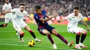 Bermain dengan 10 orang, Blaugrana justru mampu berpesta di kandang lawan dengan kemenangan 4-1. (AP Photo/Jose Breton)