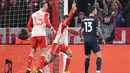 Gol kemenangan Bayern tak lepas dari kontribusi dua gol yang diciptakan Harry Kane pada menit ke-39 dan 66, ditambah Thomas Mueller (45+1'). (Kirill KUDRYAVTSEV/AFP)
