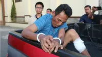 Aidil Ginting (40), pelaku pembunuhan istri dan anak tiri di Aceh. (Liputan6.com/Rino Abonita)