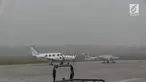 kota Palembang Minggu pagi tadi dilanda kabut tebal dengan jarak pandang hanya 500 meter. Akibatnya penerbangan pesawat di Bandara Interansional Sultan Mahmud Badaruddin Dua (SMB II) Palembang terganggu.