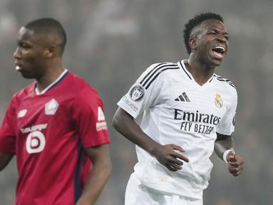 Pemain Real Madrid, Vinicius Junior, tampak kecewa setelah gagal mencetak gol ke gawang Lille pada laga Liga Champions di Stadion di Stadion Pierre Mauroy di Villeneuve-d'Ascq, Kamis (3/10/2024). (AP Photo/Thibault Camus)