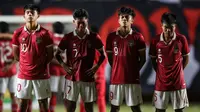 Para pemain Timnas Indonesia U-16 (kiri ke kanan) Ji Da Bin, Figo Dennis Saputrananto, Muhammad Kafiatur Rizky dan Muhammad Ridho Al Ikhsan merayakan kemenangan atas Myanmar U-16 lewat adu penalti dalam laga semifinal Piala AFF U-16 2022 antara Indonesia U-16 melawan Myanmar U-16 di Stadion Maguwoharjo, Sleman, Rabu (10/8/2022) malam WIB. (Bola.com/Bagaskara Lazuardi)