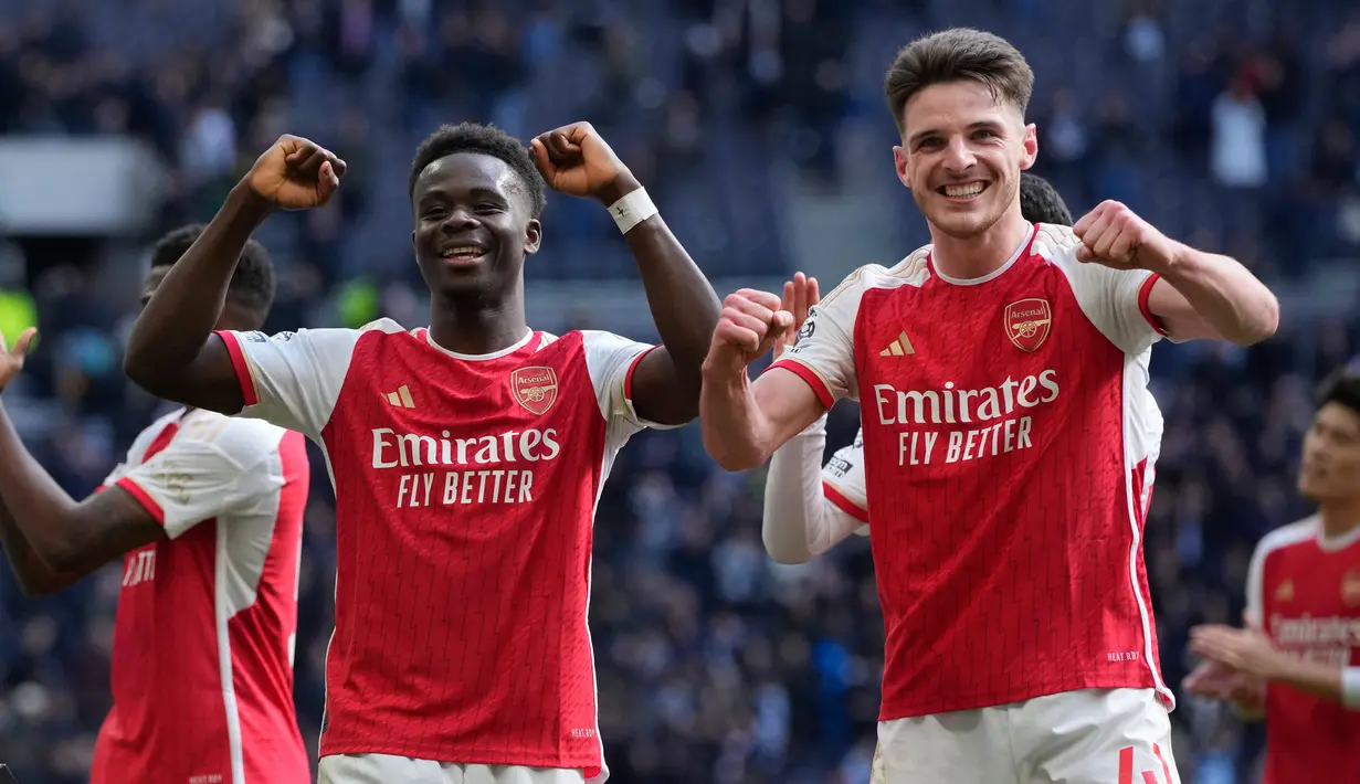 Bertandang ke markas Tottenham Hotspur, The Gunners menang tipis 3-2. (AP Photo/Kin Cheung)