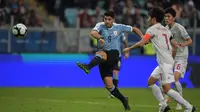Timnas Uruguay menghadapi Jepang pada laga kedua Grup C Copa America 2019, di Arena do Gremio, Jumat (21/6/2019) pagi WIB. (AFP/Carl De Souza)