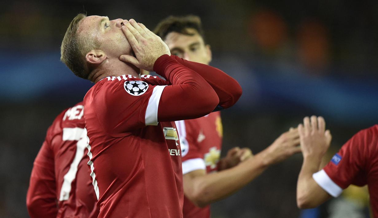 Wayne Rooney yang telah pensiun pada Januari 2021 bersama Derby County hingga kini masih tercatat sebagai pemain Inggris tertajam di Liga Champions dengan mengoleksi 30 gol hanya bersama Manchester United. Bersama MU, Wayne Rooney tampil dalam 85 laga di Liga Champions selama 11 musim, 2004/2005 hingga 2013/2014 dan 2015/2016. Satu trofi Liga Champions sukses diraihnya pada musim 2007/2008 setelah menang adu penalti 6-5 (1-1) atas Chelsea di partai final. (AFP/John Thys)