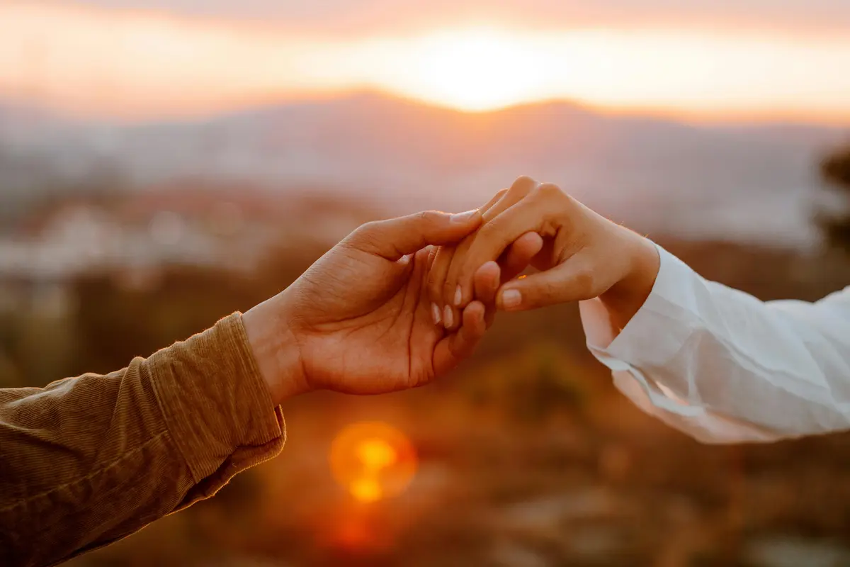 couple september holding hands