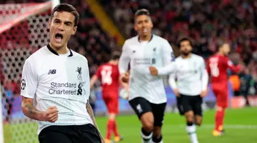 Pemain Liverpool, Philippe Coutinho berselebrasi setelah mencetak gol ke gawang Spartak Moskow pada matchday 2 Grup E Liga Champions di Otkrytiye Arena, Rabu (27/9). Liverpool harus puas bermain imbang 1-1 di kandang Spartak Moskow. (AP /Ivan Sekretarev)