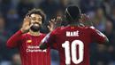Penyerang Liverpool, Mohamed Salah bersama Sadio Mane merayakan gol ke gawang KRC Genk pada laga Liga Champions 2019 di KRC Genk Arena, Rabu (23/10). Liverpool menang 4-1 atas KRC Genk. (AP/Francisco Seco)