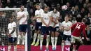 Manchester United bermain imbang Tottenham dengan skor 2-2.  (AP Photo/Alastair Grant)