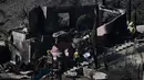 Kobaran api juga dengan cepat menyapu sekitar 10.000 hektar lahan. (Patrick T. Fallon/AFP)