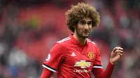 Gelandang Manchester United, Marouane Fellaini, bersedia meneruskan karier di Old Trafford asalkan mendapatkan kontrak baru berdurasi lebih dari setahun. (AFP/Paul Ellis)