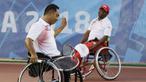 Pasangan tenis Indonesia, Erwin Subrata dan Mariyanta, tampak kecewa usai takluk dari wakil Taiwan, Chu-Yin dan Tzu-Hsuan, pada Asian Para Games di Kelapa Gading, Jakarta, Senin (8/10/2018). Indonesia takluk 2-0 dari Taiwan. (Bola.com/M Iqbal Ichsan)
