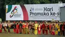 Peserta mengikuti upacara Hari Pramuka ke-56 serta pembukaan Raimuna Nasional XI, Jakarta, Senin (13/8). Penyelenggaraan ini menghadirkan perwakilan tiap kabupaten/kota, masing-masing 24 orang dari seluruh Indonesia. (Liputan6.com/Faizal Fanani)