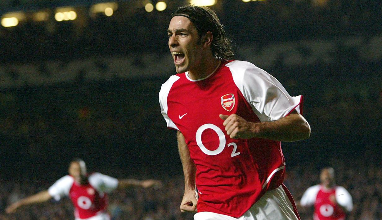 Robert Pires menjadi bagian penting Arsenal dan sangat dicintai fans Arsenal. Pires membawa Arsenal meraih 2 gelar Liga Premier Inggris dan 3 gelar Piala FA. (AFP/Odd Andersen)