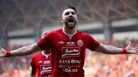 Striker Persija Jakarta, Marko Simic, melakukan selebrasi usai membobol gawang PSS Sleman pada laga Liga 1 2019 di Stadion Patrioti, Rabu (3/7). (Bola.com/Yoppy Renato)