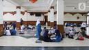 Suasana kegiatan Pesantren Kilat Ramadhan di Masjid Agung Sunda Kelapa, Menteng, Jakarta, Minggu (10/4/2022). Sebanyak 200 peserta yang terdiri dari kaum dhuafa dan yatim piatu mengikuti kegiatan Pesantren Kilat Ramadhan. (Liputan6.com/Herman Zakharia)
