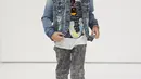 Model cilik berjalan di atas catwalk membawakan koleksi True Religion pada saat petitePARADE di Children's Club di Jacob Javitz Center di New York City (6/8). (JP Yim / Getty Images untuk petitePARADE / AFP)