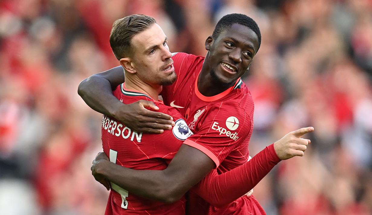 The Reds awalnya mampu tampil mendominasi permainan. Mereka bahkan mampu unggul terlebih dahulu lewat gol cepat Jordan Henderson (kiri) di menit keempat dan gol Sadio Mane di menit ke-24. (AFP/Paul Ellis)