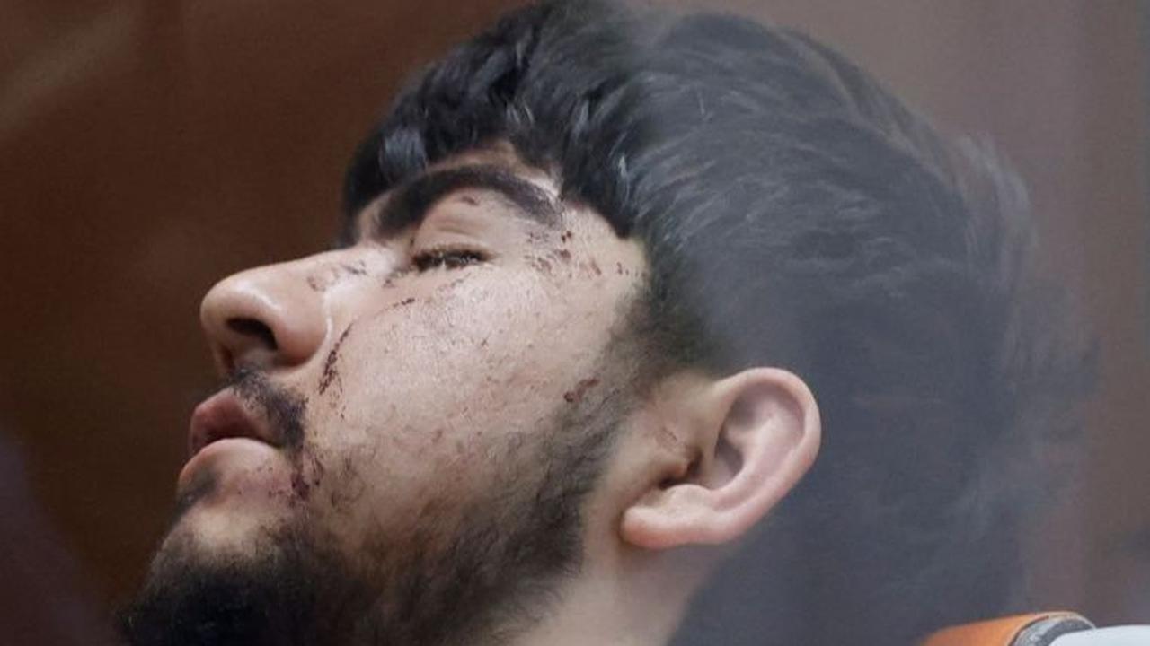 Muhammadsobir Fayzov,  tersangka penembakan di tempat konser Balai Kota Crocus, sebelum menjalani sidang di pengadilan distrik Basmanny di Moskow. Foto: REUTERS / Yulia Morozova
