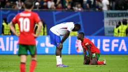 Berhasil mengalahkan Portugal, Prancis melaju ke semifinal Euro 2024. (PATRICIA DE MELO MOREIRA/AFP)