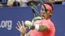 Petenis Spanyol, Rafael Nadal, mengembalikan bola saat bertanding melawan petenis Rusia, Andrey Rublev, pada laga turnamen AS Terbuka di New York, Rabu (6/9/2017). Nadal menang 3 set langsung 6-1, 6-1 dan 6-2 atas Andrey Rublev. (AP/Adam Hunger)