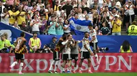 Bek Jerman bernomor punggung 18, Nathaniel Brown (C), merayakan gol kelima timnya bersama rekan-rekan setimnya selama pertandingan Grup E Piala Dunia 2026 antara Jerman dan Curaçao di Stadion Houston, Houston, pada 14 Juni 2026. (RONALDO SCHEMIDT/AFP)